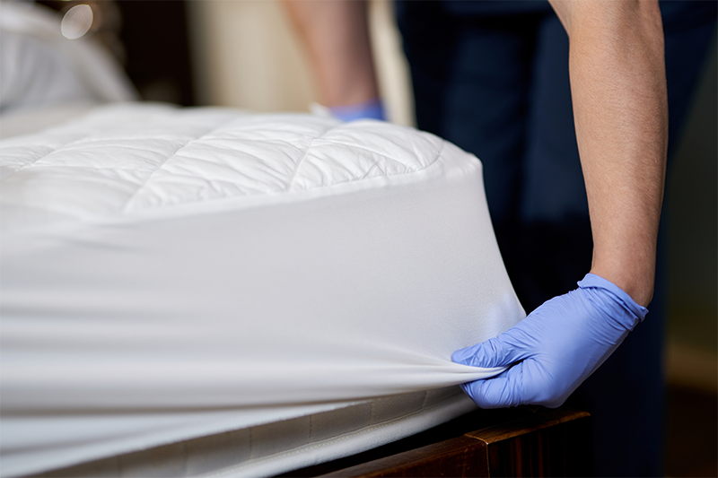 cleaner tuck the sheet under the mattress in London